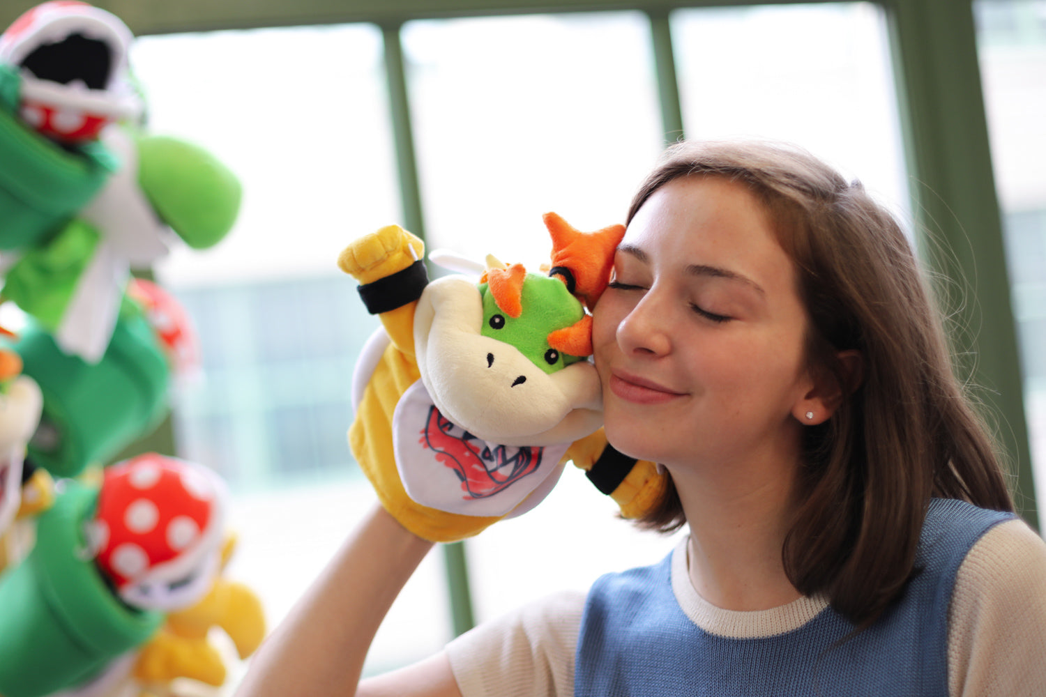 A model snuggling our Bowser Jr. Puppet
