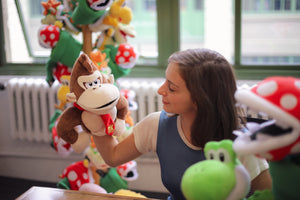 Donkey Kong puppet on model's armd